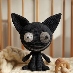 May include: A white ceramic mug with a black handle and the text "But First, Coffee" in a handwritten style. The mug is on a white surface. The mug is approximately 4 inches tall.