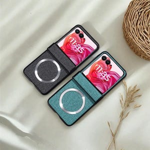 May include: Two phone cases with a fabric texture and a magnetic charging ring. One case is gray, the other is teal. Both cases have a black frame and display a phone screen showing the time 11:35.
