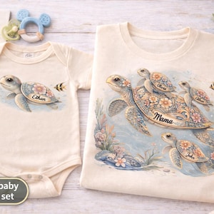 May include: Mom and baby matching set. A cream-colored onesie and t-shirt featuring watercolor sea turtles with floral accents. The onesie has "Ethan" printed on it. The t-shirt has "Mama", "Olivia", and "John" printed on it.