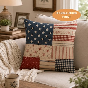May include: A square throw pillow featuring a patchwork design with a blue section containing white stars, alongside panels of red and white stripes, floral patterns, red polka dots, and blue gingham checks. The pillow includes a double-sided print.