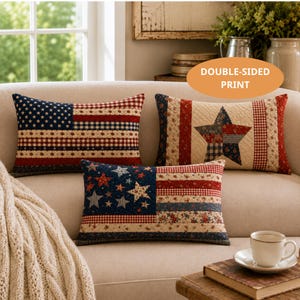 May include: Three rectangular throw pillows featuring patchwork designs with red, white, and blue colors. The patterns include stars, stripes, and floral motifs. One pillow displays a flag-like design, another a large central star, and the third stars.