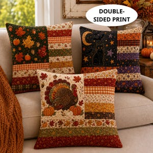 May include: Three square throw pillows featuring seasonal patchwork designs. One displays autumn leaves and pumpkins, another a black cat with a crescent moon, and the third a turkey with pumpkins. Each pillow has a double-sided print.