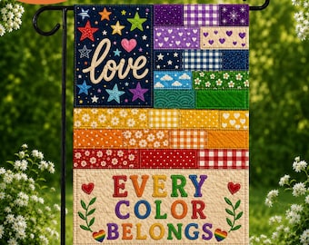 May include: A rectangular garden flag featuring a patchwork design with various patterns and colors. The top section displays the word love and colorful stars. The bottom section features the text EVERY COLOR BELONGS in rainbow letters.