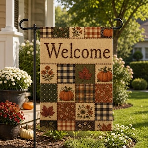 May include: A rectangular garden flag featuring a patchwork design of autumn-themed squares, including pumpkins, fall leaves, flowers, and plaid patterns. The word Welcome is printed in large, dark brown letters across the top section.