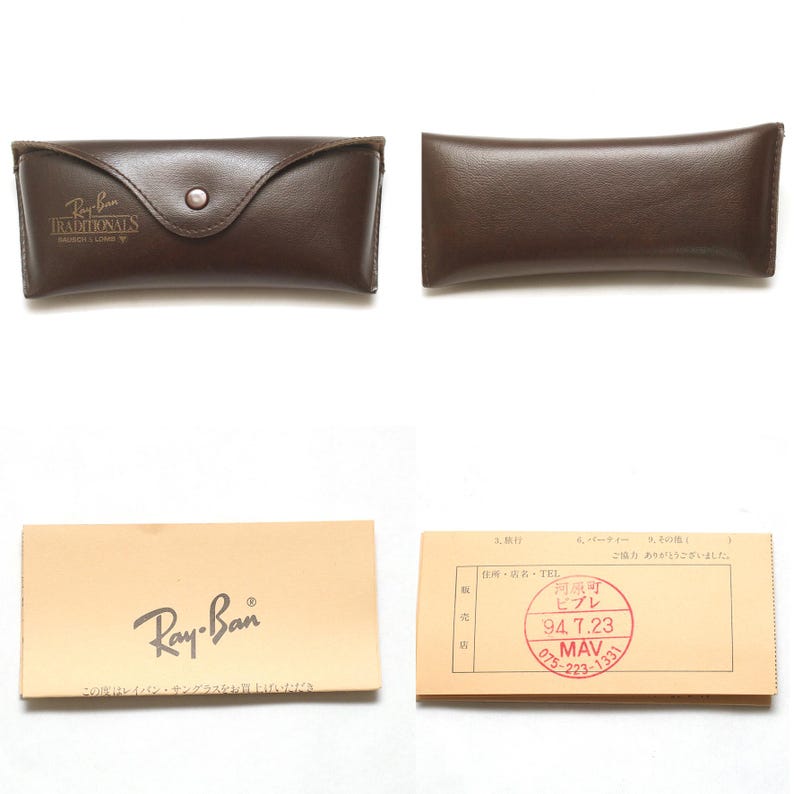 May include: A collection of Ray-Ban accessories, including a brown leather case with a button closure and the text "Ray-Ban TRADITIONALS". Also included is a tan box with the Ray-Ban logo and a small card.