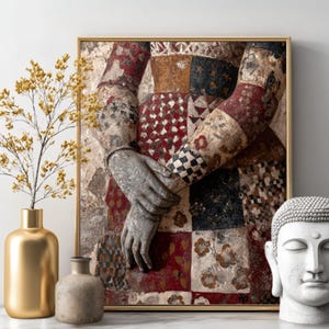 May include: A framed artwork featuring a detailed depiction of arms and hands, with a patchwork design in red, black, and beige. A gold vase with yellow flowers and a white Buddha head are also in the image.