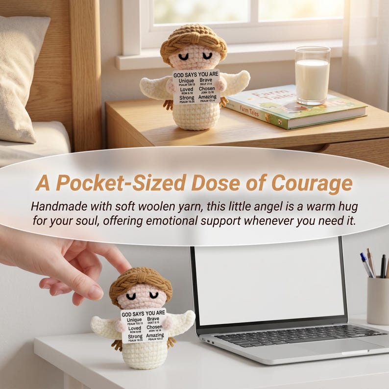 May include: A crocheted angel figurine with a tan halo and wings, holding a sign that reads "GOD SAYS YOU ARE." The text "A Pocket-Sized Dose of Courage" is above the angel. The angel is on a nightstand next to a book and a glass of milk.