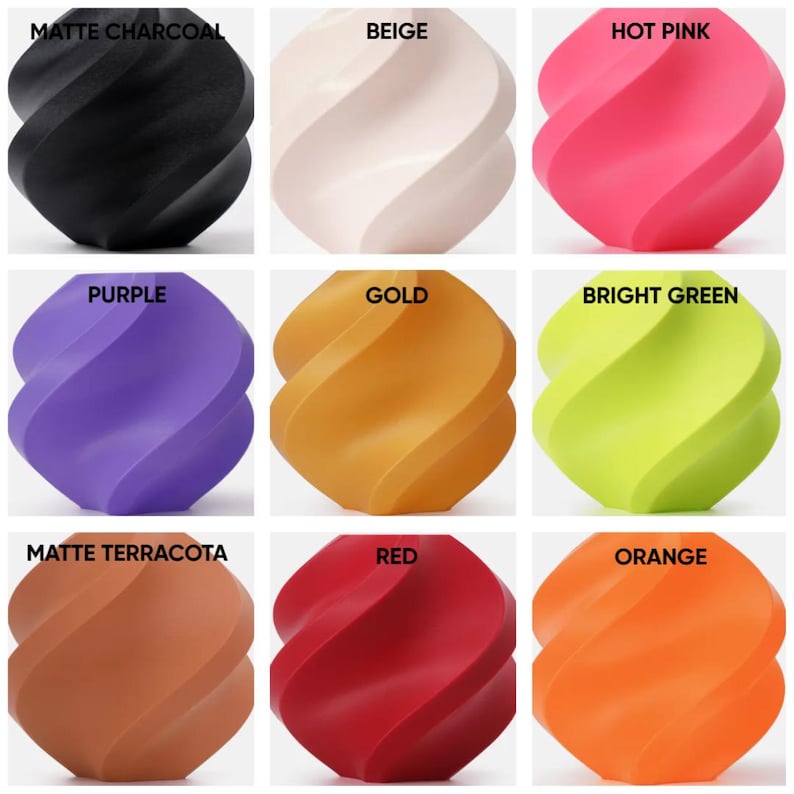 May include: A grid of nine spherical objects with a twisted, spiral design. The colors are labeled as matte charcoal, beige, hot pink, purple, gold, bright green, matte terracotta, red, and orange. Each object features a smooth, uniform finish.