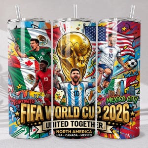 May include: A cylindrical tumbler with a straw featuring a colorful graphic design of the 2026 FIFA World Cup. The print includes soccer players, the World Cup trophy, national flags, and the text FIFA WORLD CUP 2026 UNITED TOGETHER NORTH AMERICA.