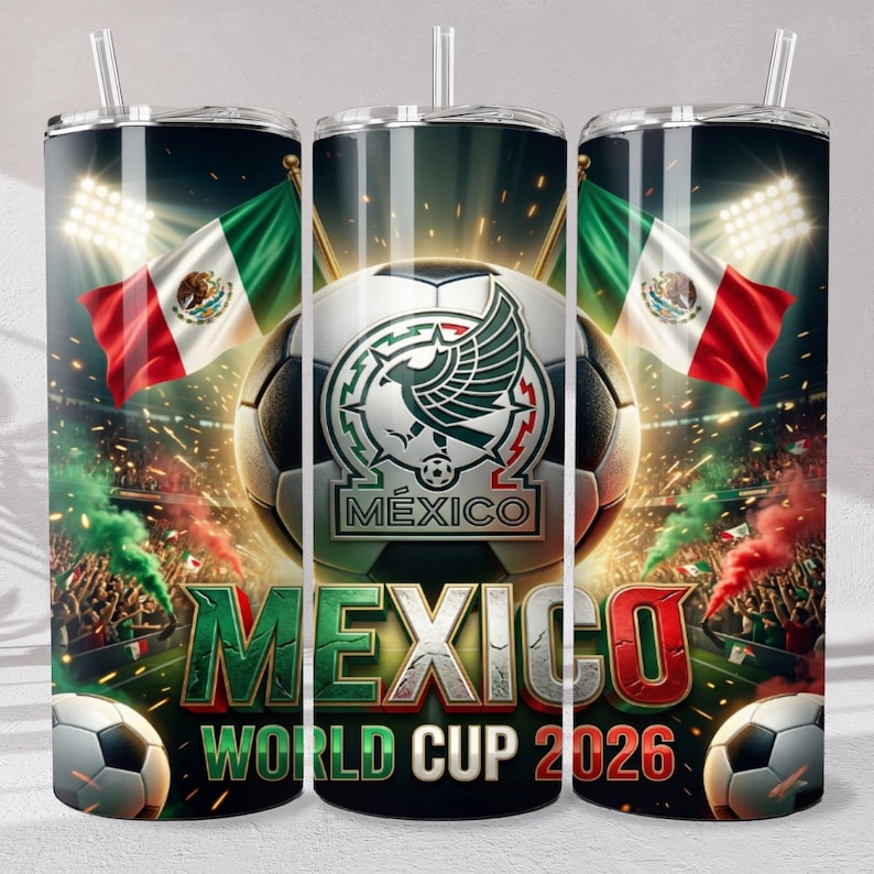 May include: A cylindrical tumbler with a straw featuring a soccer theme, the Mexican flag, a soccer ball with a stylized eagle emblem, and the text MEXICO WORLD CUP 2026. The design includes stadium lights, crowd scenes, and green and red smoke.