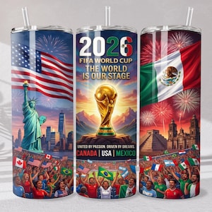 May include: A cylindrical tumbler with a straw featuring a 2026 FIFA World Cup design. The graphics include the Statue of Liberty, the US flag, the Mexican flag, the World Cup trophy, fireworks, and the text 2026 FIFA WORLD CUP THE WORLD IS OUR STAGE.