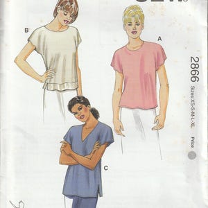 May include: Kwik Sew pattern 2866 for misses' tops. The pattern includes illustrations of three different top styles in XS-XL sizes. The pattern features the Kwik Sew logo and the designer's name, Kerstin Martensson.