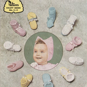 May include: The cover of Patons Craft Book No. C.15, showcasing a baby in a pink bonnet, encircled by an assortment of knitted baby booties in soft hues. The book's title is "Patons Bootee Book, featuring Bonnets and 22 Different Bootee Designs."