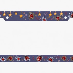 May include: A rectangular license plate frame with a dark blue background featuring a repeating pattern of red and black ladybugs and yellow stars. The frame has two circular mounting holes at the top and a flat, smooth surface finish.