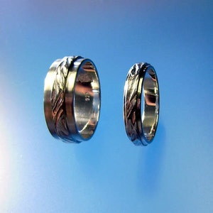 Water on sand wedding rings image 4
