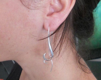 Long silver curl earrings