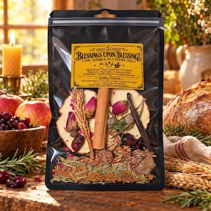 May include: A clear plastic pouch containing a simmer pot blend with a yellow label reading Blessings Upon Blessings. The blend includes dried apple slices, cinnamon sticks, rose buds, cranberries, rosemary, and vanilla beans visible inside.
