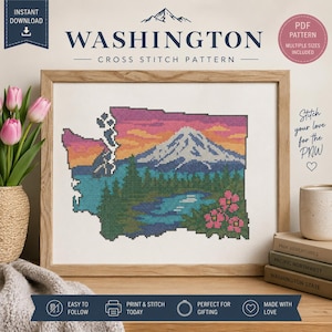 May include: A framed cross-stitch pattern depicting the state of Washington, with a mountain scene and sunset colours. The design includes the text "WASHINGTON CROSS STITCH PATTERN" and "INSTANT DOWNLOAD". The image is in a wooden frame.