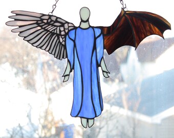 Stained-glass suncatcher of a half angel, half demon