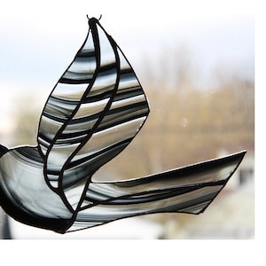 glass suncatcher of a flying bird