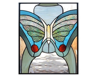 stained glass art panel of butterfly in blue and green