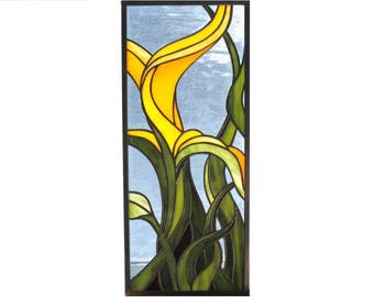 Stained glass panel of plant in yellow blue and green