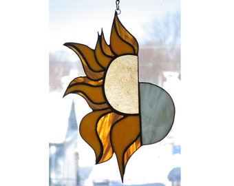 stained glass suncatcher of the sun and moon