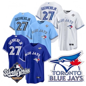 May include: A collection of Toronto Blue Jays baseball jerseys in various shades of blue and white. The jerseys feature the team logo, player name "GUERRERO JR." and the number 27. Some jerseys have "World Series 2025" patches.