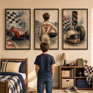 May include: Three framed watercolor-style wall art prints featuring racing themes. The left shows a red race car with number 7, the center depicts a driver in a racing suit labeled BRENNAN 7, and the right displays a helmet, tire, and traffic light.
