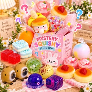 May include: A pink Mystery Squishy Blind Box featuring a white rabbit illustration and text, surrounded by various squishy toys including capybaras, strawberry-topped pancakes, a purple octopus, red cubes, blue sandwich cookies, and colorful bead balls.