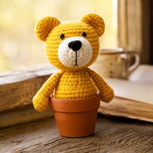 May include: A white ceramic mug with a black handle and the text "But First, Coffee" in a black, bold font. The mug is on a white surface.