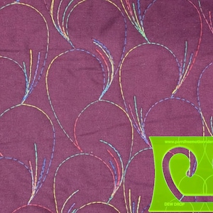 May include: A deep purple fabric featuring a repeating pattern of embroidered teardrop shapes stitched in multicolored thread. A bright green plastic quilting template with the text "DEW DROP" and "www.perrsfreemotionrulers.com No-40b" is visible.