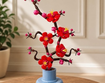 Composizione di elementi decorativi per la composizione di orchidee e fiori di prugno, decorazione botanica creativa per la scrivania.