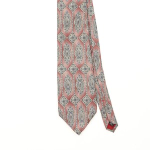 May include: A necktie featuring a repeating geometric pattern of elongated hexagons in shades of dusty rose and muted blue. The design includes intricate, symmetrical floral-inspired motifs centred within each hexagon, set against a textured background.