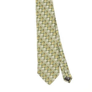 May include: A necktie featuring a repeating geometric pattern of wavy, interlocking squares in shades of sage green, olive, and cream. The fabric has a subtle sheen, and a small black label is visible on the back of the narrow end of the tie.