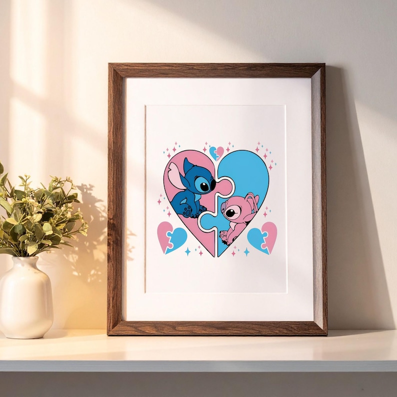 May include: A framed wall art print featuring a large heart composed of two interlocking puzzle pieces. The left side is pink with a blue Stitch character, and the right side is blue with a pink Angel character. Small heart and star accents surround them.