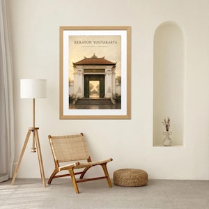 May include: A framed wall art print titled KERATON YOGYAKARTA YOGYAKARTA INDONESIA featuring a detailed illustration of a traditional Javanese gate structure with a brown tiled roof, white pillars, and dark green doors set against a soft yellow sky.