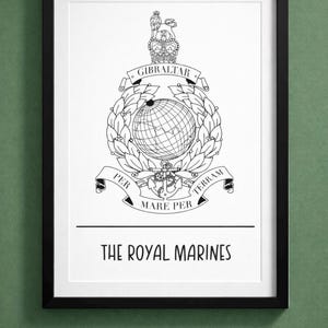 May include: Framed black and white print of the Royal Marines emblem. The design includes a globe, anchor, and the text "GIBRALTAR", "PER MARE PER TERRAM", and "THE ROYAL MARINES". The print is displayed against a green backdrop.