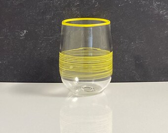 Stemless glass with white swirl and white rim