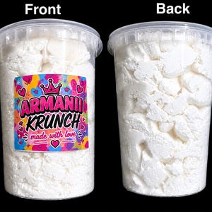 May include: Two clear plastic containers filled with white, irregular, chunky pieces. The front container features a colorful label with pink, orange, and blue patterns, a crown icon, and the text ARMANII KRUNCH made with love.