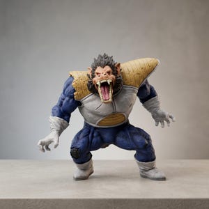 May include: A detailed figurine of a large ape-like character in a dynamic pose. The figure is predominantly blue with white and tan armour, and white gloves and boots. The ape has a snarling expression with sharp teeth.