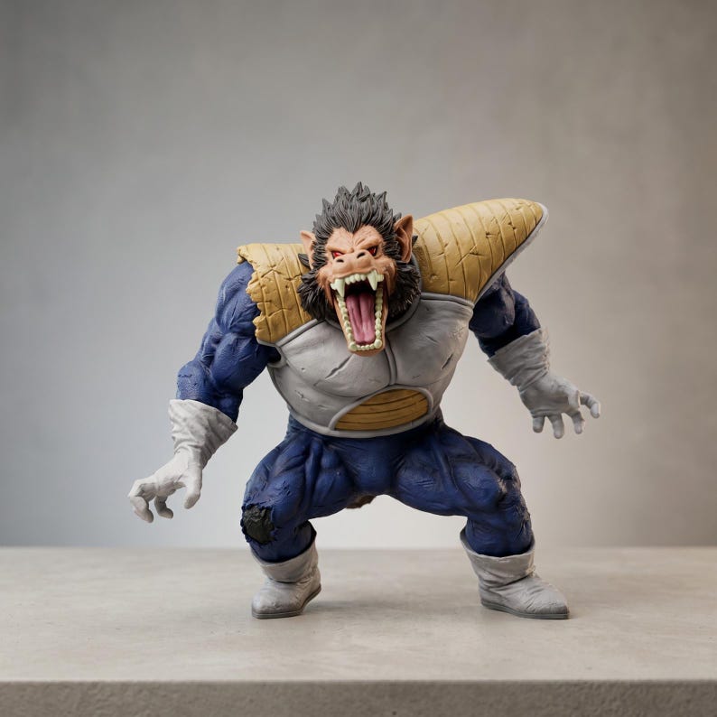 May include: A detailed figurine of a large ape-like character in a dynamic pose. The figure is predominantly blue with white and tan armour, and white gloves and boots. The ape has a snarling expression with sharp teeth.