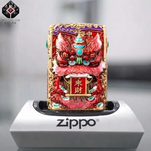 May include: A Zippo lighter featuring a detailed red and gold lion design with turquoise accents. The lighter has Chinese characters on a scroll and is displayed on a white stand. The Obsidian Spark logo is visible in the upper left corner.