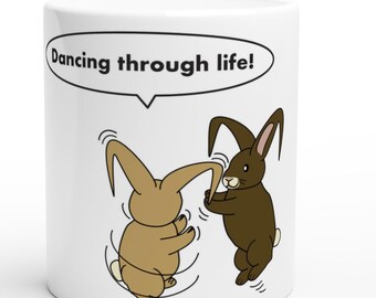 Cute ceramic mug with original lop-eared rabbit illustration. Dancing through life! Perfect for coffee, tea, or hot chocolate.