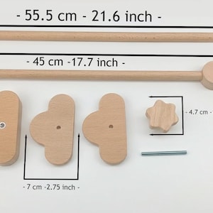 May include: Wooden baby mobile parts, including a 21.6-inch (55.5 cm) long rod, a 17.7-inch (45 cm) long rod, three cloud-shaped pieces (2.75 inches/7 cm wide, 4.72 inches/12 cm tall), a star-shaped piece (1.85 inches/4.7 cm), and a metal rod.