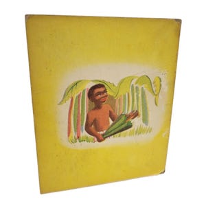 May include: Vintage book cover with a yellow background and a colorful illustration. The illustration depicts a smiling, dark-skinned child holding a green umbrella under a leafy canopy. The artwork has a retro style.