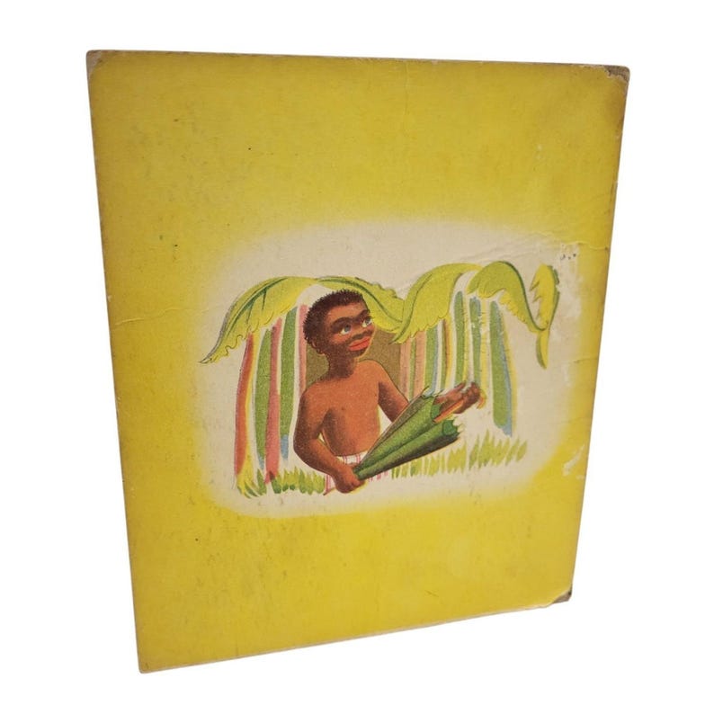 May include: Vintage book cover with a yellow background and a colorful illustration. The illustration depicts a smiling, dark-skinned child holding a green umbrella under a leafy canopy. The artwork has a retro style.