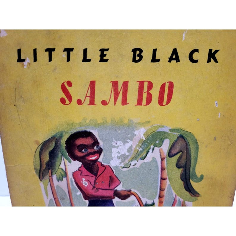 May include: Vintage children's book cover with the title "LITTLE BLACK SAMBO" in black and red lettering. The cover features an illustration of a smiling Black child in a red shirt and blue pants, with palm trees in the background.