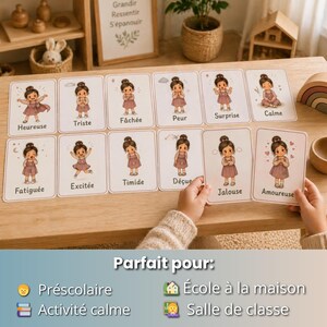 May include: A set of emotion flashcards featuring illustrations of a girl expressing different feelings. Each card has a word describing the emotion in French. The cards are displayed on a wooden surface.