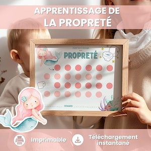 Può includere: Un grafico con cornice in legno con il testo "Apprentissage de la Propreté" e un tema sirena. Il grafico presenta cerchi rosa per monitorare i progressi, un'illustrazione del water e le parole "Imprimable" e "Téléchargement instantané".